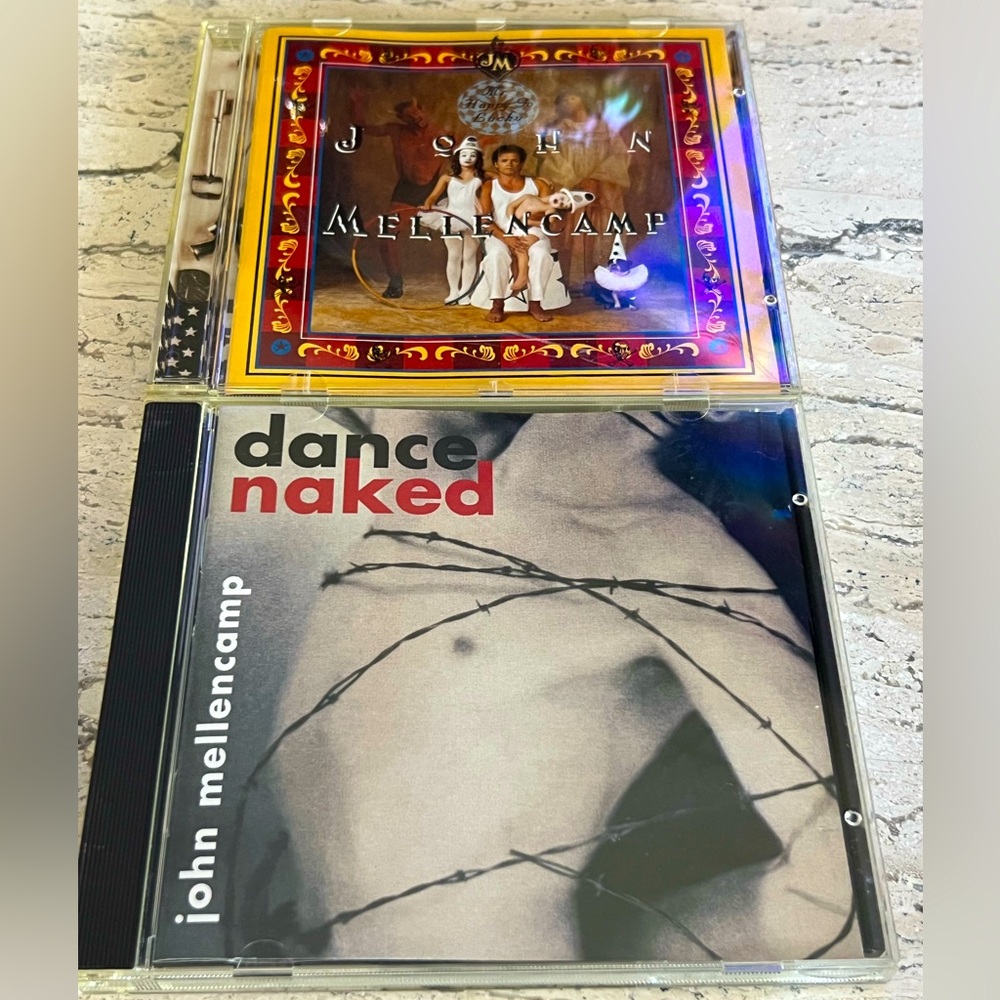 2 John Mellencamp CD’s -Titles: Mr. Happy Go Lucky and Dance Naked